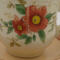 This shows the front details of the flowers as well as the details of the saucer.,